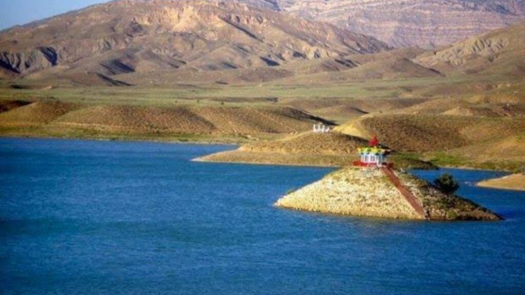 Calm waters of Hanna Lake with surrounding mountains