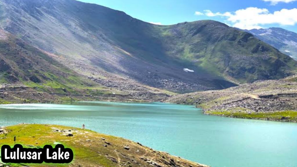 Lulusar Lake with calm blue water and surrounding mountains